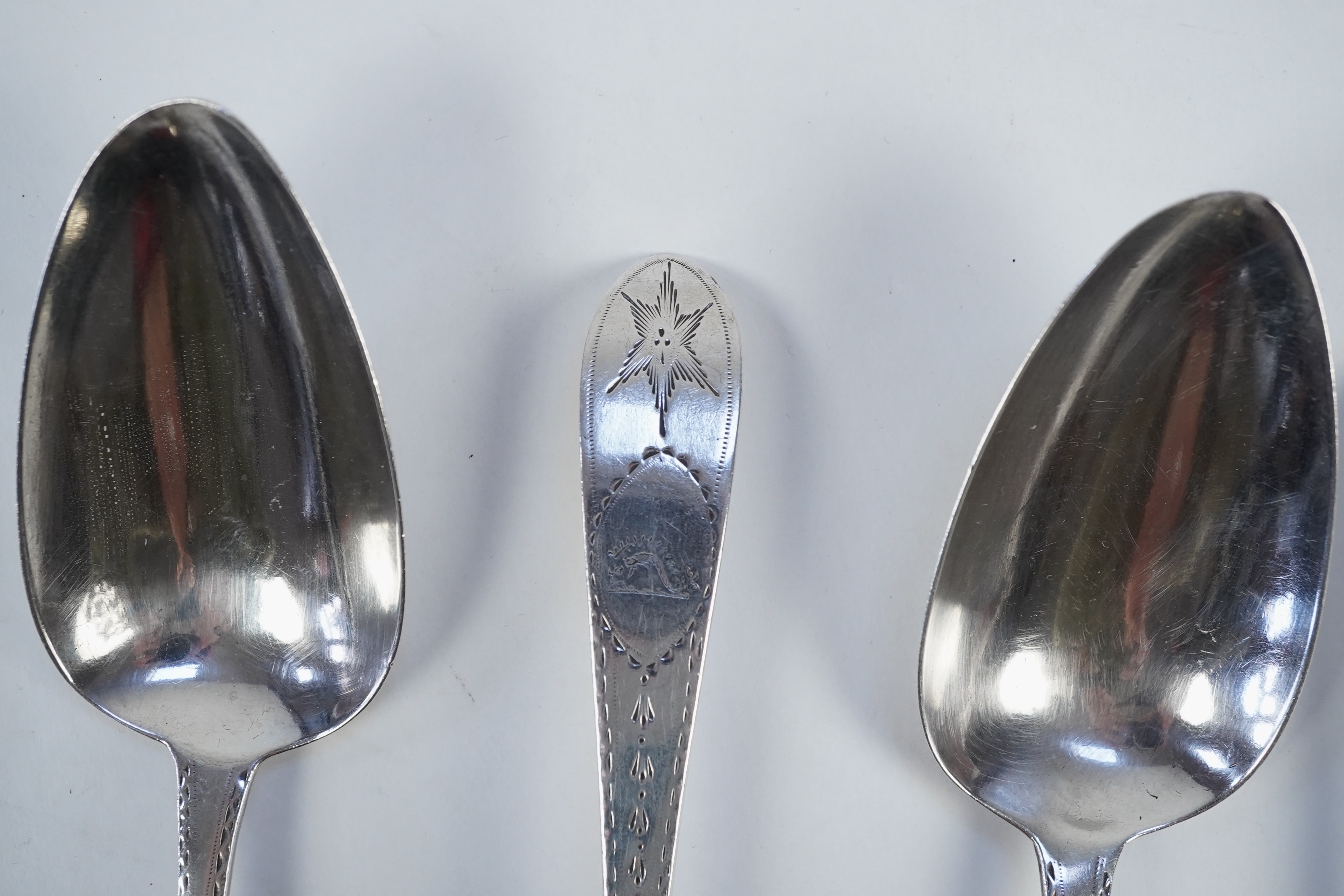 A set of six George III Irish silver bright cut engraved serving/table spoons by John Pittar